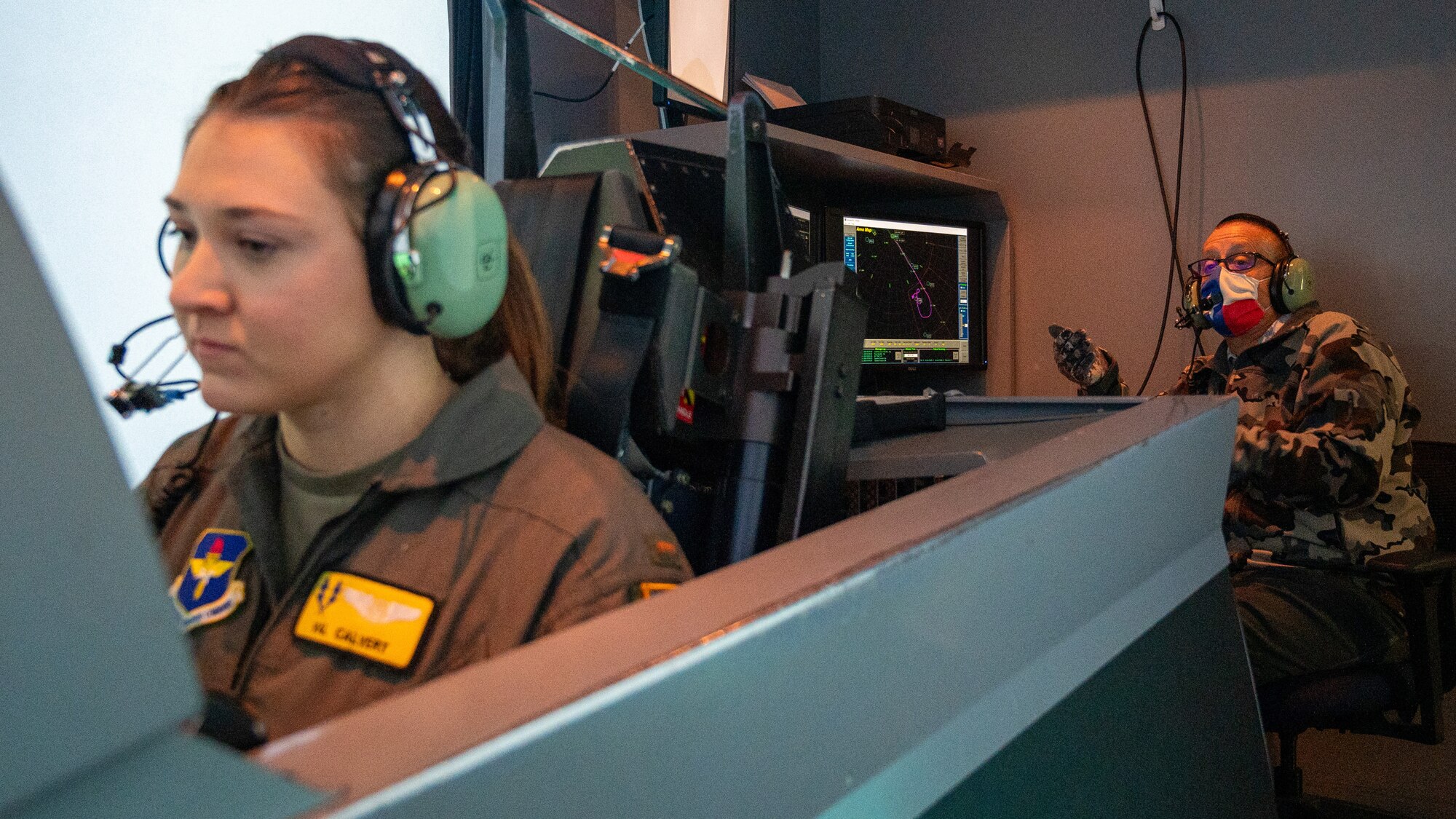 U.S. Air Force Capt. Harrison Frank (right), 434th Flying Training Squadron instructor pilot, mentors Capt. Timothy Starkey (left), 47th Student Squadron student pilot, using T-6A Texan II models to demonstrate flight movements at Laughlin Air Force Base, Texas, Jan. 8, 2024. Mentorship is a necessary part of the growth of young pilots, allowing them to gain unique experience from teachers and become more proficient flyers. January is National Mentoring Month and 2024’s theme is “Are You Ready?” posing Airmen whether they are ready to be the next generation of leaders. (U.S. Air Force photo by Staff Sgt. Nicholas Larsen)