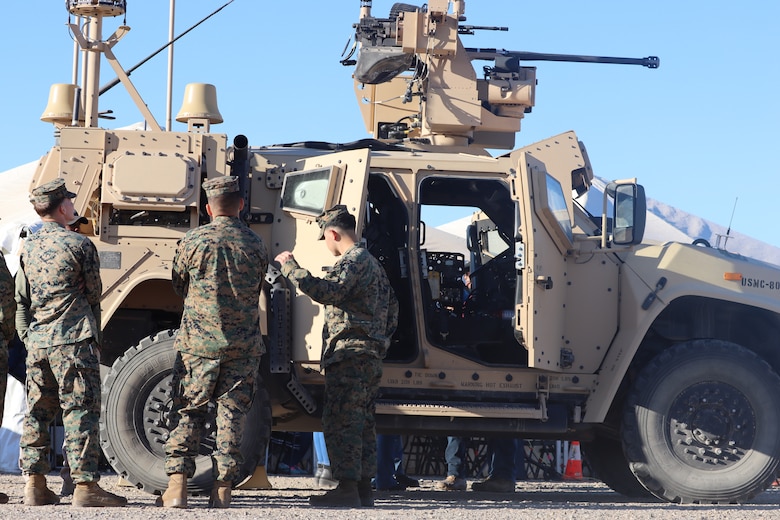 U.S. Marines with Combat Logistics Company-16, 1st Maintenance Battalion, 1st Marine Logistics Group observe the Marine Air Defense Integrated System at Yuma Proving Ground, Arizona, December 13, 2023. The MADIS Mk1, pictured, and Mk2 form a complementary pair and will be the basic building block of the Low Altitude Air Defense (LAAD) Battalions’ ground-based air defense capability. (U.S. Marine Corps photo by Virginia Guffey)