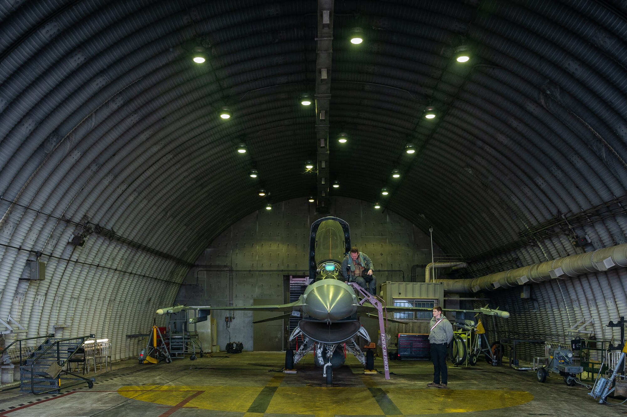 U.S. Air Force Lt. Col. Alexis Scott, 36th Fighter Squadron pilot, loads bags onto an F-16 Fighting Falcon aircraft at Osan Air Base, Republic of Korea, Jan. 9, 2024. Pilots have to fly on a regular basis to ensure they retain the skills that would be required in real world scenarios. (U.S. Air Force photo by Airman 1st Class Chase Verzaal)