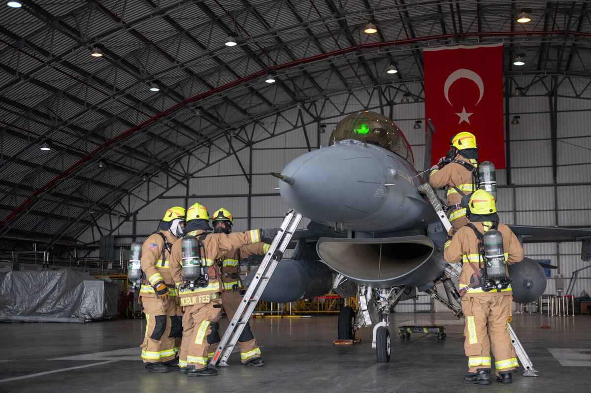 Firefighters assigned to the 39th Civil Engineer Squadron conduct a simulated unconscious pilot rescue operation during a crash, damaged, or disabled aircraft recovery (CDDAR) exercise at Incirlik Air Base, Türkiye, Jan. 8, 2024.