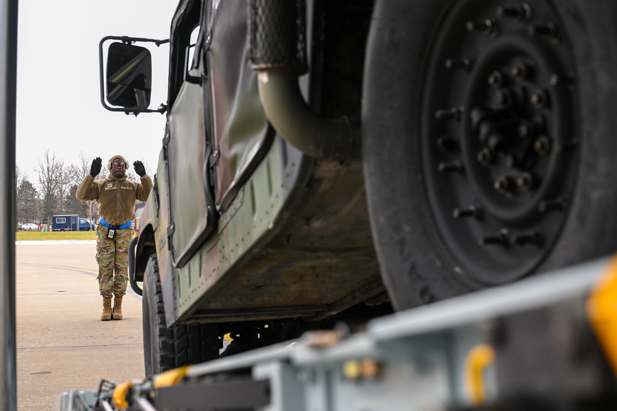 Staff Sgt. Rashawn Rahim, a port dawg with the 76th Aerial Port Squadron, backs a Humvee onto a C-130H Hercules aircraft on Jan. 6, 2024, at Youngstown Air Reserve Station, Ohio.