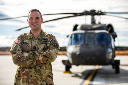 Capt. Brendan Meehan poses for a photo at the New Hampshire Army Aviation Support Facility in Concord, New Hampshire. Meehan was injured during an Iranian missile strike Jan. 8, 2020, in Al Asad Air Base, Iraq. After about two years of extensive treatment, the pilot is now flying again and commanding a unit.