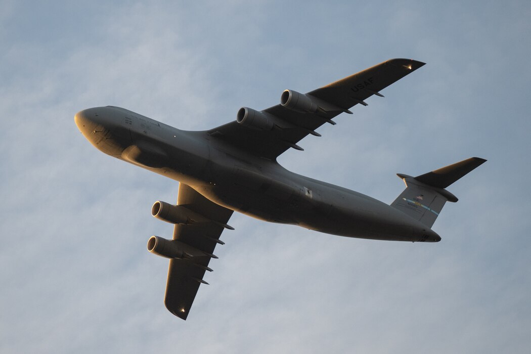 A C5-M Super Galaxy piloted by members of the 9th Airlift Squadron flies over a Wreaths Across America Honor Stop