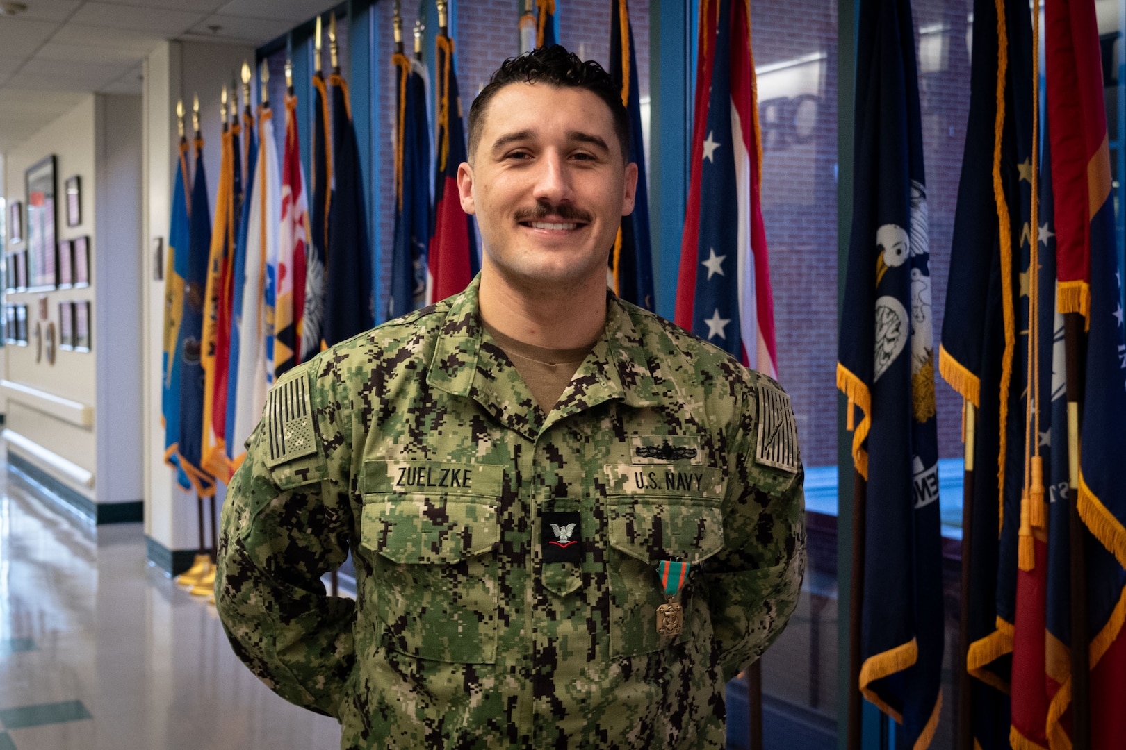 Hospital Corpsman Third Class Colin Zuelzke received the Navy and Marine Corps Commendation Medal on Thursday, January 11 in recognition of his service aboard Naval Health Clinic Cherry Point’s Patient Centered Medical Home.