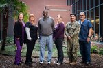 Staff aboard Naval Health Clinic Cherry Point celebrate the service and dedication of Mr. Tyrone Nevels.  Nevels, center, departed the clinic Thursday, January 11, 2024 after serving aboard the facility for 22 years as a General Schedule Civilian Radiology Technologist.