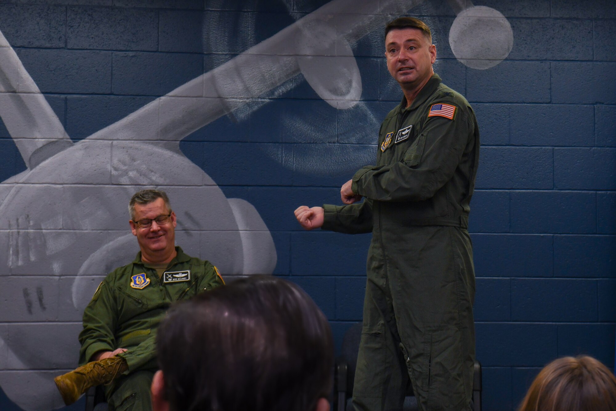 Col. Michael Maloney, commander of the 910th Airlift Wing, laughs with Col. John Sebesta, incoming commander of the 910th Operations Group, during Sebesta’s assumption of command speech on Jan. 6, 2024, at Youngstown Air Reserve Station, Ohio.