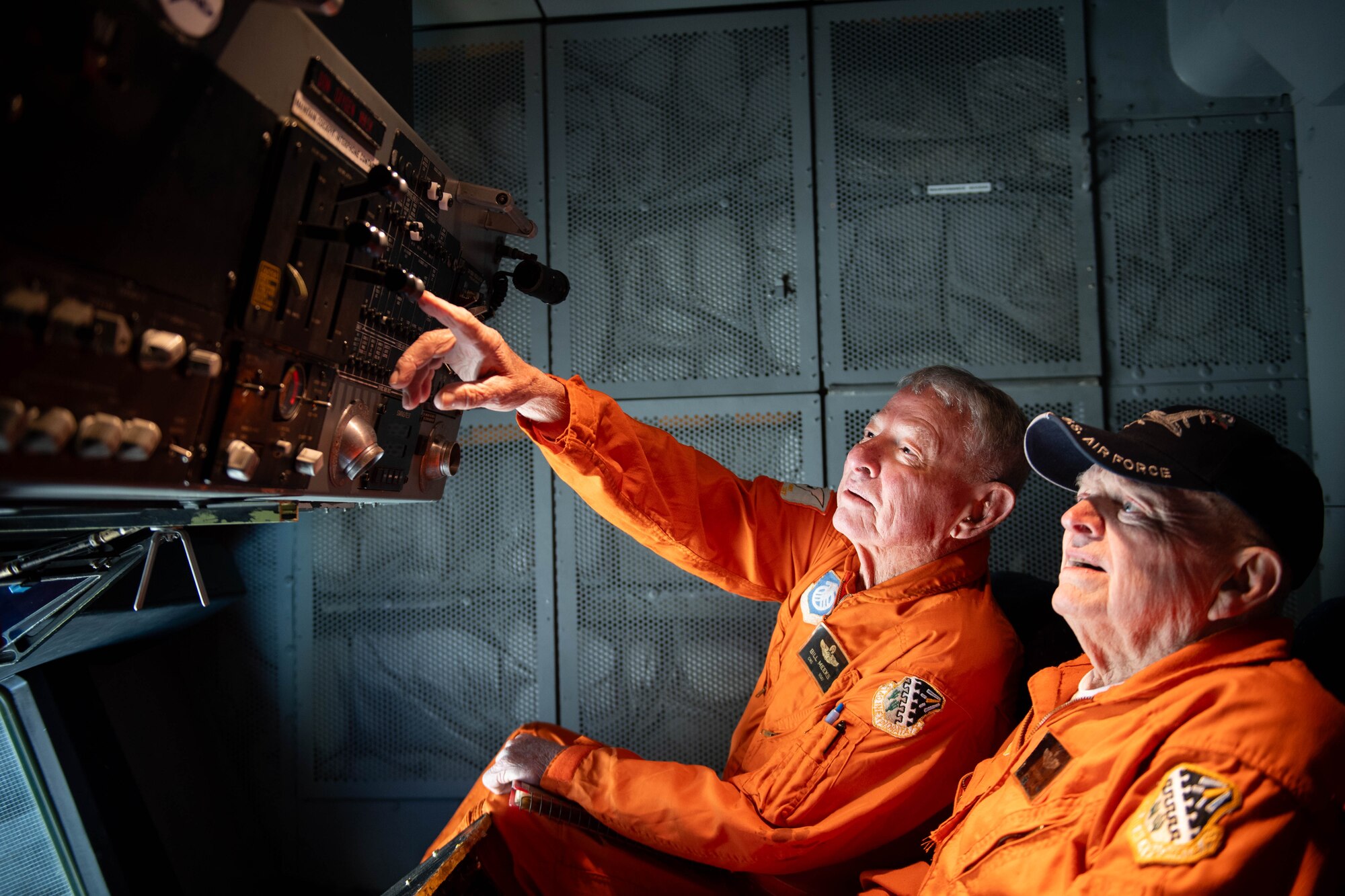 Retired U.S. Air Force Chief Master Sgt. Billy Meeks and Master Sgt. Jimmy Cronwell analyzes instruments inside of KC-10A 79-0433 at Dover Air Force Base, Delaware, Dec. 12, 2023. Meeks and Cronwell were members of the flight test crew for the KC-10A 79-0433 as boom operators. Meeks and Cronwell were instrumental in establishing boom operations in the KC-10A. Tail number 79-0433 was the first of 60 KC-10A aircraft produced for the Air Force by McDonnell-Douglas and used primarily for aerial refueling. (U.S. Air Force photo by Tech. Sgt. J.D. Strong II)