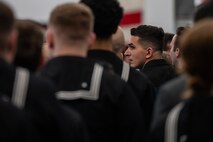 A photo of several people standing in formation.