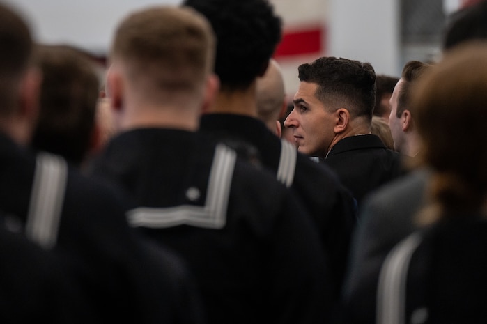 A photo of several people standing in formation.