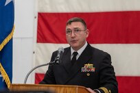 A photo of a man at a podium.