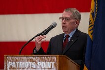 A photo of a man at a podium.