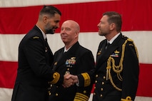 A photo of two men shaking hands.