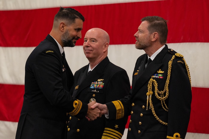 A photo of two men shaking hands.