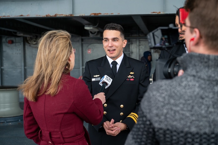 A photo of a man being interviewed.