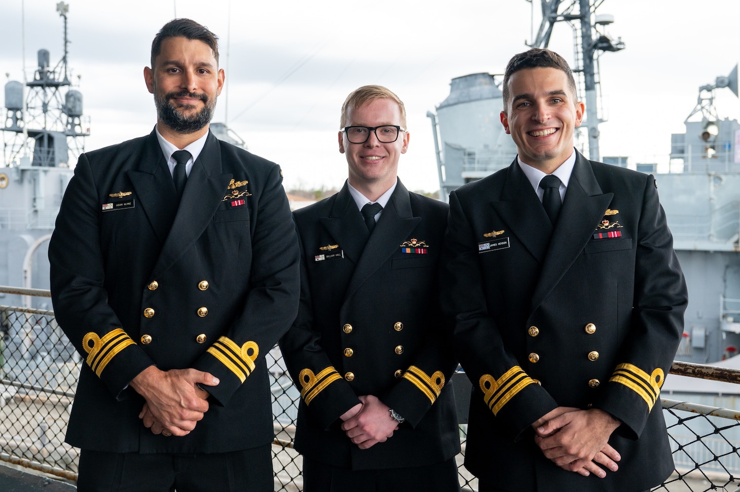 Royal Australian Navy Lt. Cmdr. Adam Klyne (left), Lt. William Hall (middle), and Lt. Cmdr. James Heydon (right), U.S. Navy’s Nuclear Power Training Unit - Charleston graduates, pose for a photo aboard USS Yorktown (CV 10) at the Patriots Point Naval and Maritime Museum in Mt. Pleasant, South Carolina, Jan. 12, 2024.