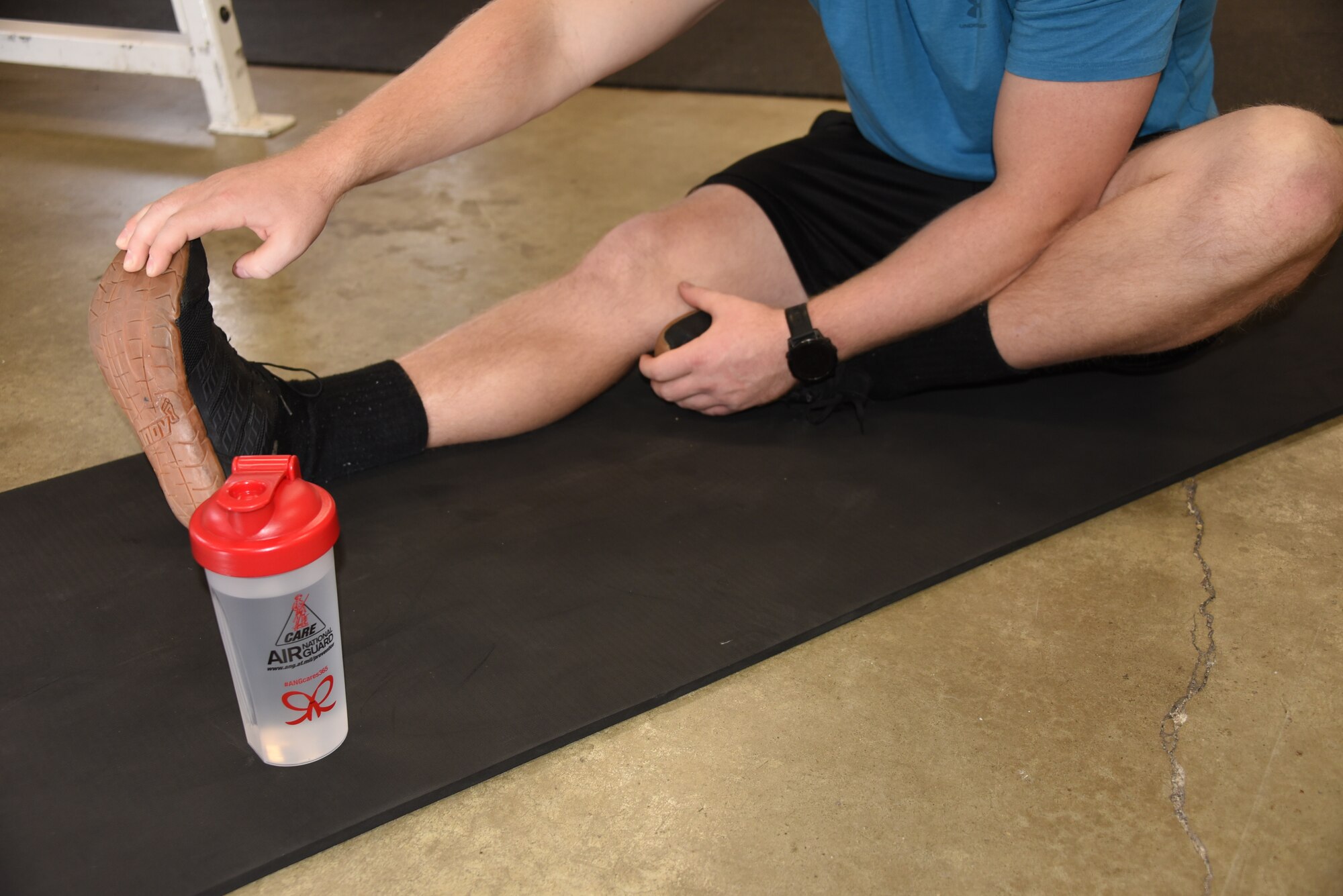 U.S. Air National Guard Technical Sgt. Devon Parr, a 185th Air Refueling Wing aerospace propulsion technician, stretches