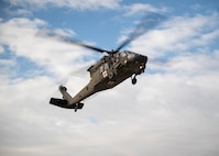 A UH-60 comes into land with simulated patients on Dec. 7, 2023, at Joint Base San Antonio-Camp Bullis, Texas, during Operation AGILE Medic. This joint force medical training exercise immerses medics in the seamless process of transporting patients from the Expeditionary Medical Support unit to the En Route Patient Staging System team, and onwards to Air Evacuation and Critical Care Air Transport Teams, and vice versa. The hands-on experience ensures medics gain a comprehensive understanding of communication protocols, the critical timing for patient preparation, and the intricacies of the entire process. (U.S. Air Force photo by Senior Airman Melody Bordeaux)