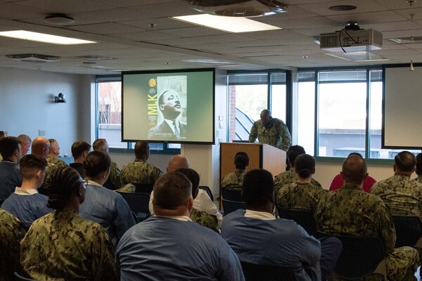 A Sailor serving aboard Naval Health Clinic Cherry Point reads a portion of the “I Have a Dream” speech during a special observance held Thursday, January 11 celebrating the life and legacy of Martin Luther King Jr.