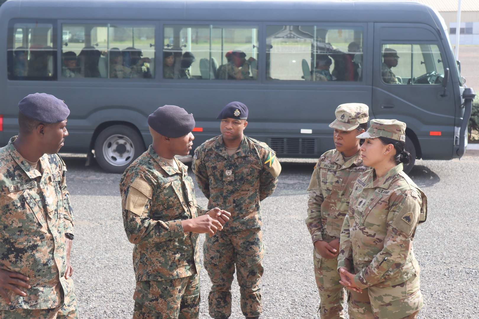 Sgt. Maj. Esmeralda Vaquerano, G-1 (personnel) Sergeant Major for the D.C. Army National Guard and Sgt. Jessica A. Frazer, Recruitment and Retention Battalion, D.C. Army National Guard are briefed by members of the Jamaica Defence Force (JDF) during a State Partnership Program visit to the Caribbean Military Academy (CMA), Dec. 12-14, 2023. D.C. Guard members participated in an NCO Career Development Subject Matter Expert Exchange (SMEE) which included reviewing training, promotions, leadership, duties and responsibilities of NCOs with JDF’s Jamaica Regiment, Support Brigade, and the Martitime, Air and Cyber Command (MACC).