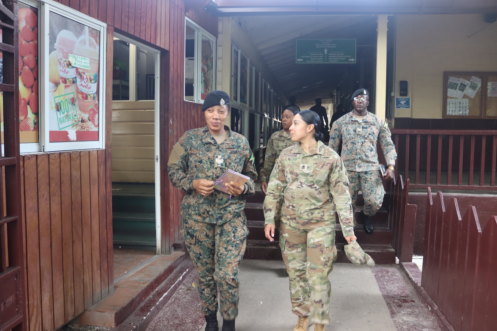 Sgt. Maj. Esmeralda Vaquerano, G-1 (personnel) Sergeant Major for the D.C. Army National Guard receives a tour from a member of the Jamaica Defence Force (JDF) during a State Partnership Program visit to the Caribbean Military Academy (CMA), Dec. 12-14, 2023. D.C. Guard members participated in an NCO Career Development Subject Matter Expert Exchange (SMEE) which included reviewing training, promotions, leadership, duties and responsibilities of NCOs with JDF’s Jamaica Regiment, Support Brigade, and the Martitime, Air and Cyber Command (MACC).