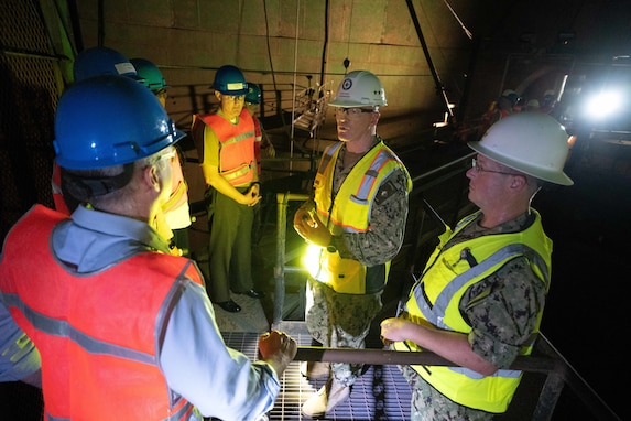 Joint Task Force-Red Hill (JTF-RH) Commander, U.S. Navy Vice Adm. John Wade (center), administers a tour for Honorable Erik K. Raven, Under Secretary of the U.S. Navy (left), inside the Red Hill Bulk Fuel Storage Facility (RHBFSF) January 11, 2024.
