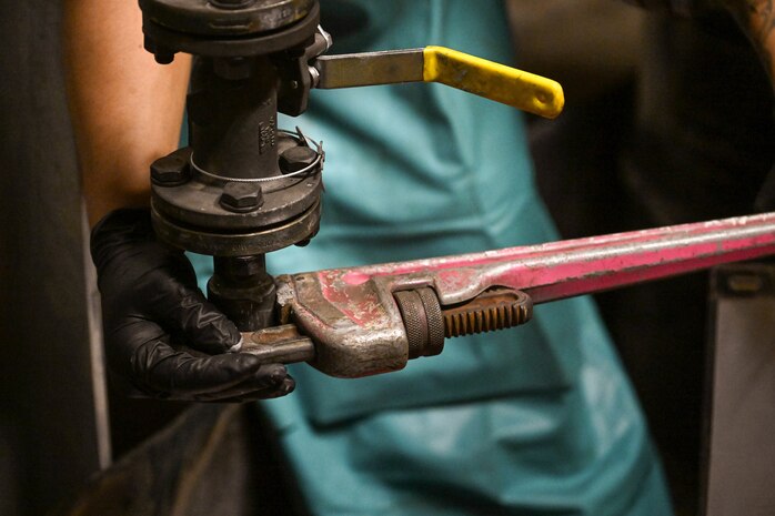 A member in support of Joint Task Force-Red Hill (JTF-RH) secures a valve as part of the process of removing residual fuel from the Red Hill Bulk Fuel Storage Facility Jan. 15, 2024, Halawa, Hawaii.