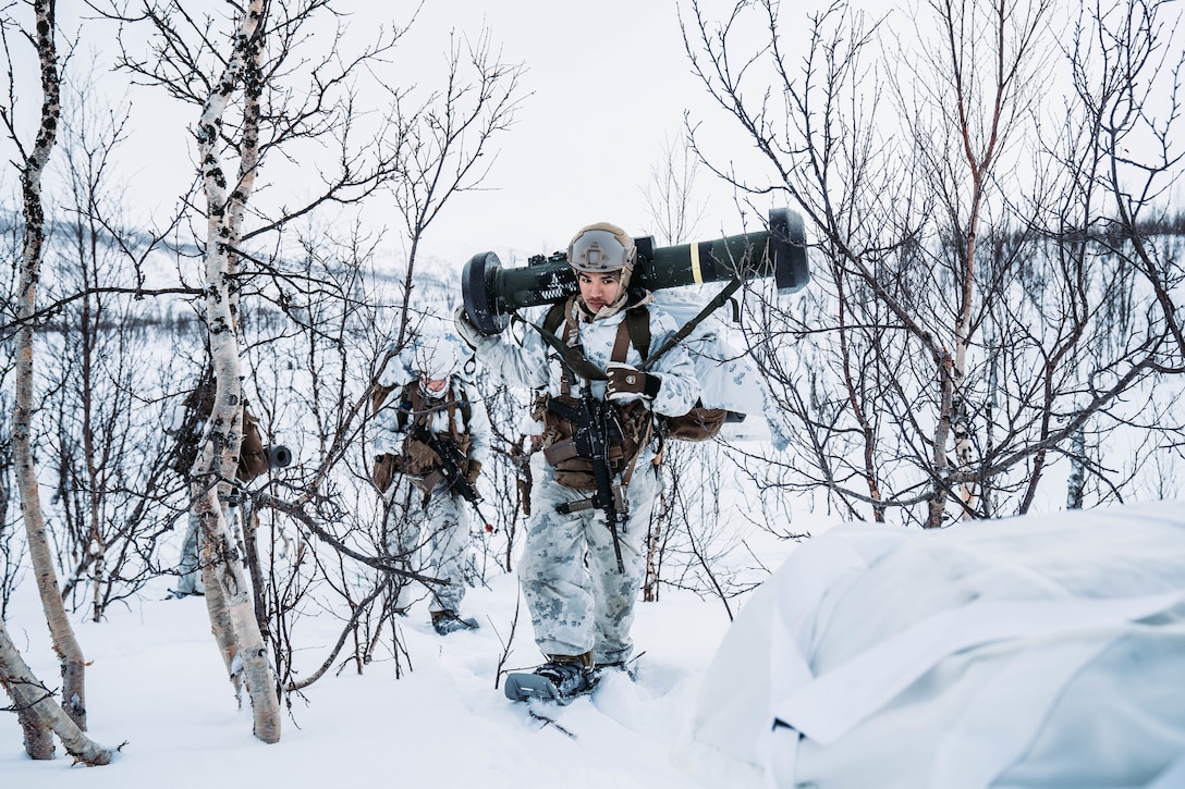 A U.S. Marine with Jaeger (Hunter) concept platoon, 3rd Battalion, 6th Marine Regiment, 2nd Marine Division, carries an FGM-148 Javelin to a hide site position prior to Exercise Cold Response 22 in Setermoen, Norway, March 3, 2022. Exercise Cold Response 22 is a biennial Norwegian national readiness and defense exercise that takes place across Norway, with participation from each of its military services, including 26 North Atlantic Treaty Organization (NATO) allied nations and regional partners. (U.S. Marine Corps photo by Sgt. William Chockey)