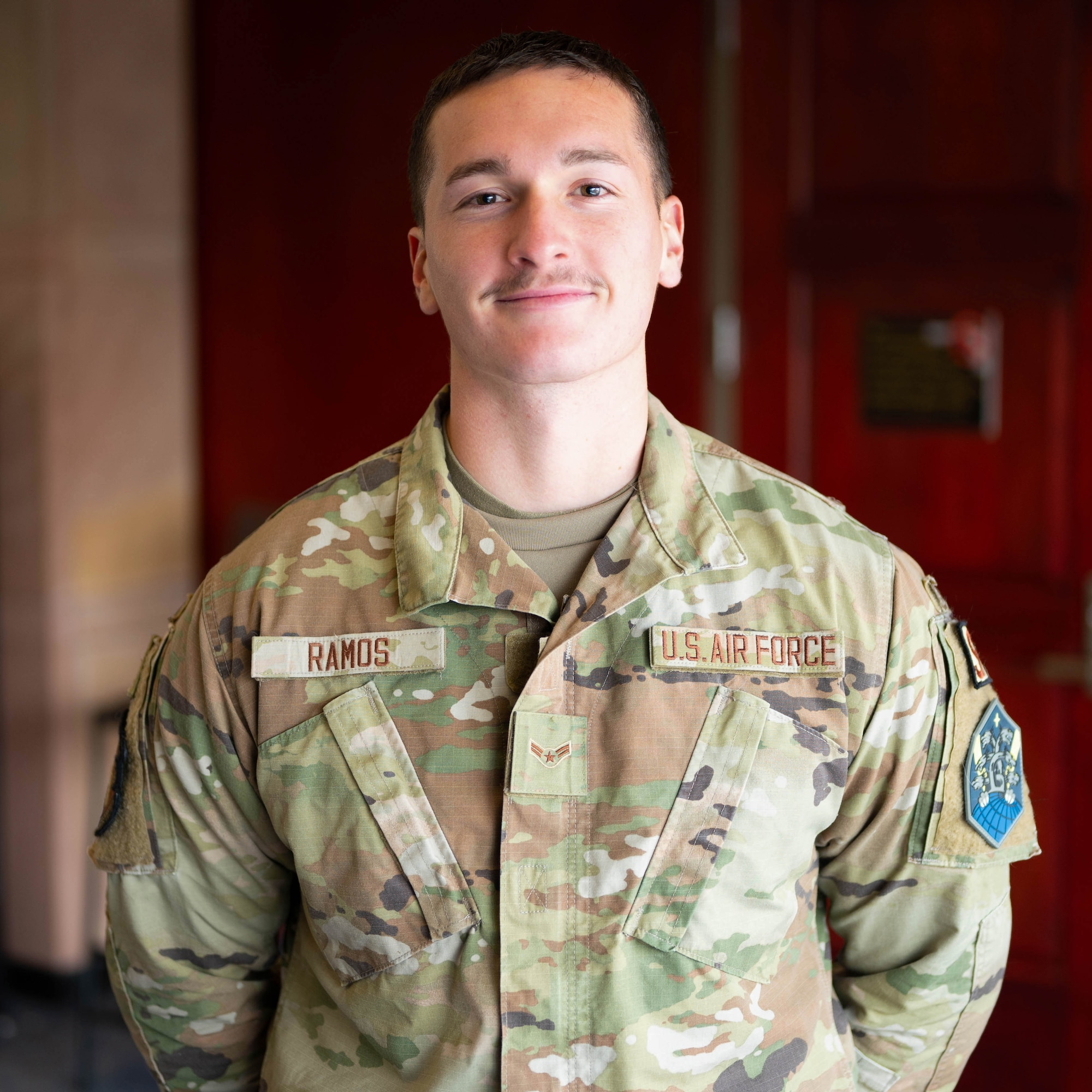 A man in uniform poses for a photo