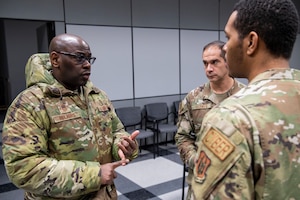 U.S. Air Force Senior Master Sgt. Vincent Majors, communications flight superintendent of the 514th Force Support Squadron, 514th Air Mobility Wing, discusses preparations for a unit effectiveness inspection with Senior Master Sgt. Daniel Varnes, an inspector general inspection specialist with the 514th AMW, and Staff Sgt. Isaiah Hairston, a client systems technician with the 514th Force Support Squadron, 514th AMW, at Joint Base McGuire-Dix-Lakehurst, N.J., on Jan. 7, 2024.