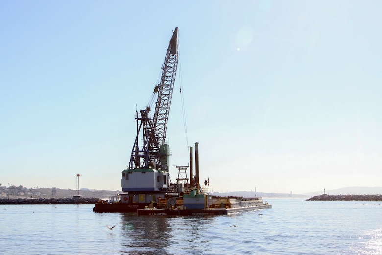 The Seahorse, a utility vessel positioned near the north jetty of Marina del Rey Harbor in Los Angeles County, dredges material Jan. 9 from the harbor's entrance channel.