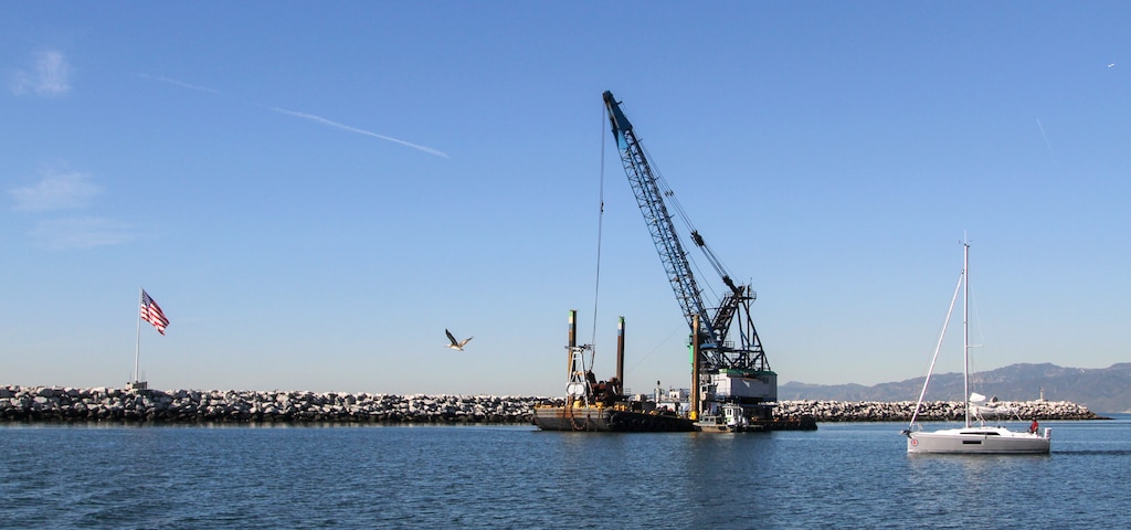 The Seahorse, a utility vessel positioned near the north jetty of Marina del Rey Harbor in Los Angeles County, dredges material Jan. 9 from the harbor's entrance channel.