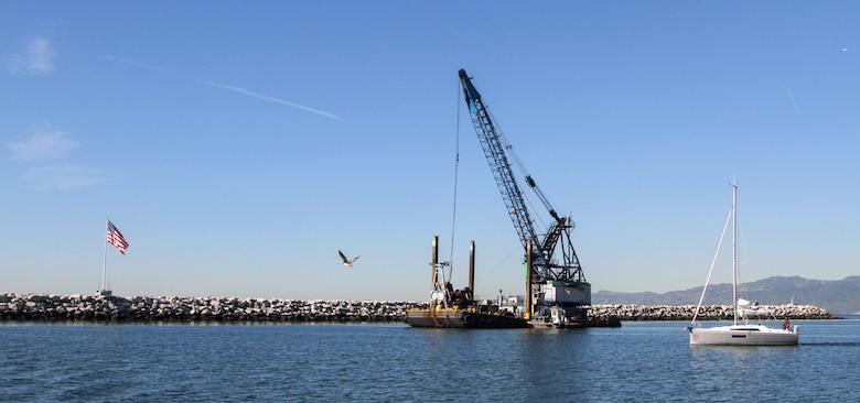 The Seahorse, a utility vessel positioned near the north jetty of Marina del Rey Harbor in Los Angeles County, dredges material Jan. 9 from the harbor's entrance channel.