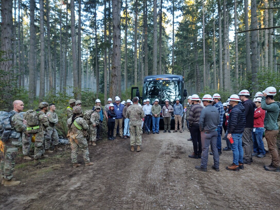 Army Fellows discussing construction activity at Joint Base Lewis McChord.