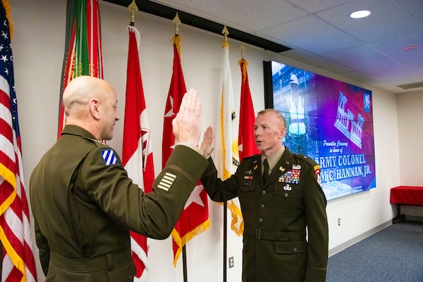 U.S. Army Lt. Gen. Scott A. Spellmon, 55th Chief of Engineers and Commanding General of the U.S. Army Corps of Engineers administers the Oath of Office to U.S. Army Col. William C. Hannan, Jr., U.S. Army Corps of Engineers Transatlantic Division commander, during Hannan's promotion ceremony to Brigadier General, Jan. 16, in Winchester, Virginia.