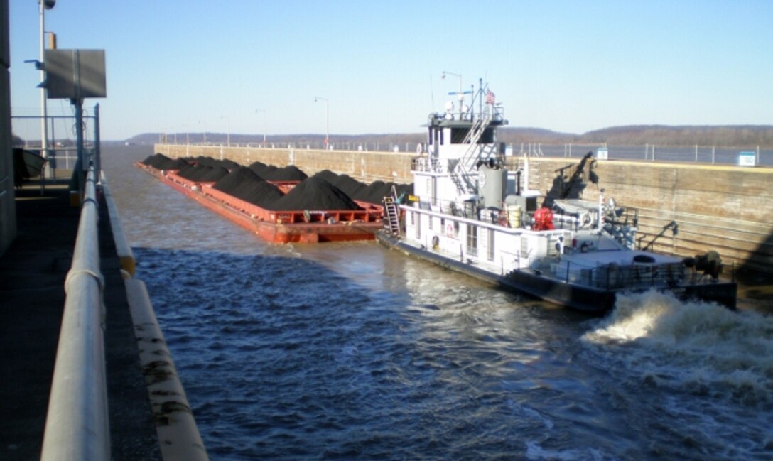 A barge locking through at Smithland Locks and Dam in Brookport, Illinois.