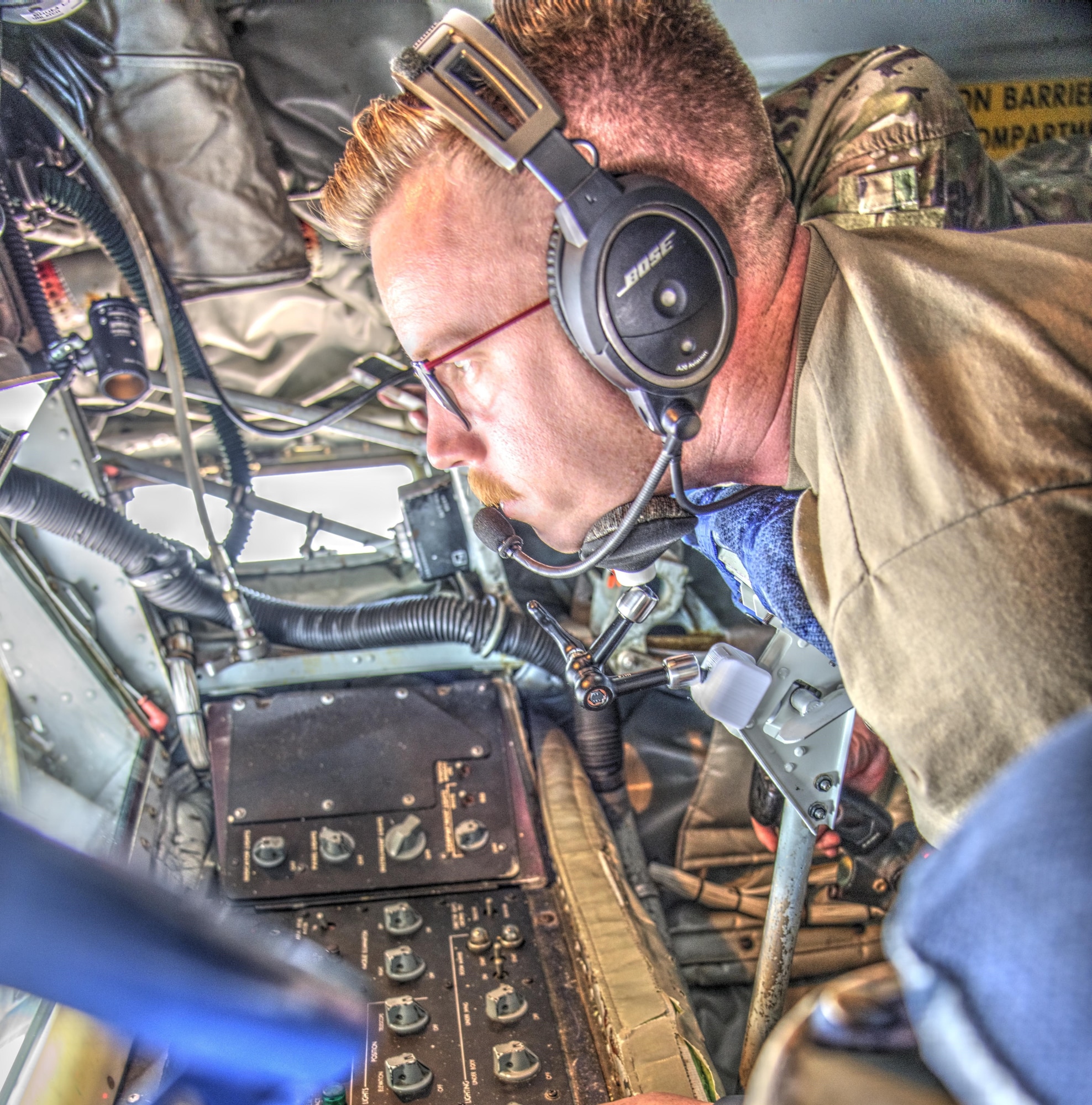 U.S. Air Force Master Sgt. Lucas Treat, 54th Air Refueling Squadron instructor boom operator, utilizes an adjustable KC-135 Stratotanker chin rest at Altus Air Force Base, Oklahoma, Aug. 22, 2023. The chin rests were designed by Airmen with the use of the Wing Innovation Advancement Center, or Spark Cell, to reduce back strain for boom operators while in their duty position. (Courtesy photo by U.S. Air Force Capt. Mark Richardson)