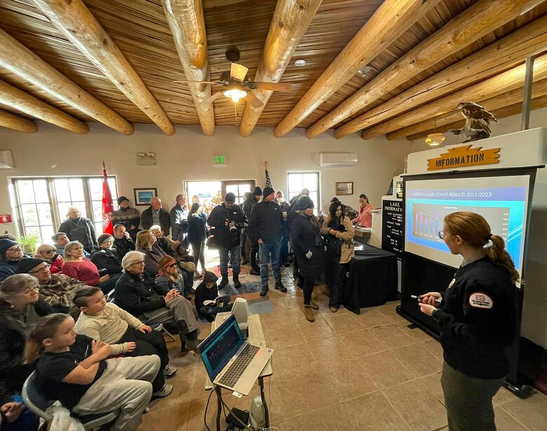 Volunteers listen to the presentation at the visitors’ center about eagles before heading out to count them during the annual midwinter bald eagle survey at Abiquiu Lake, N.M., Jan. 6, 2024.