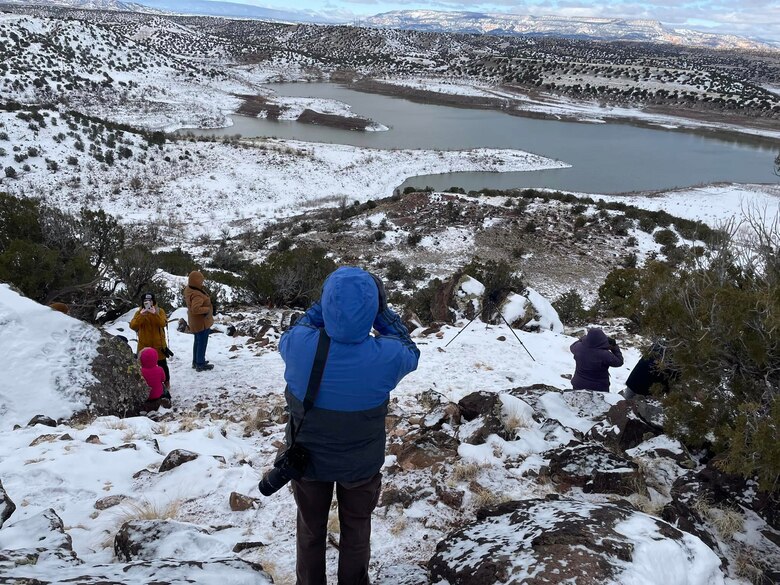 Volunteers on an overlook at Abiquiu Lake, N.M., look for eagles during the annual mid-winter bald eagle survey there, Jan. 6, 2024.