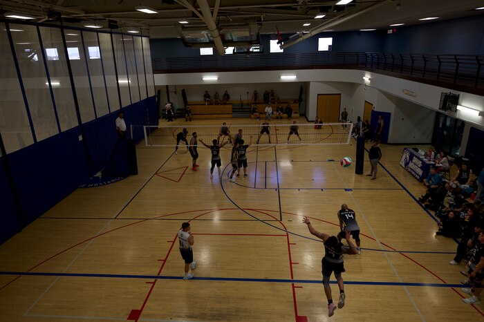 U.S. Airmen play in a volleyball tournament at Davis-Monthan Air Force Base, Ariz., Jan. 13, 2024. Teams from eight Air Force bases competed for a chance to play in the national volleyball tournament in Fort Sam Houston, Texas. (U.S. Air Force photo by Airman 1st Class Robert Allen Cooke III)
