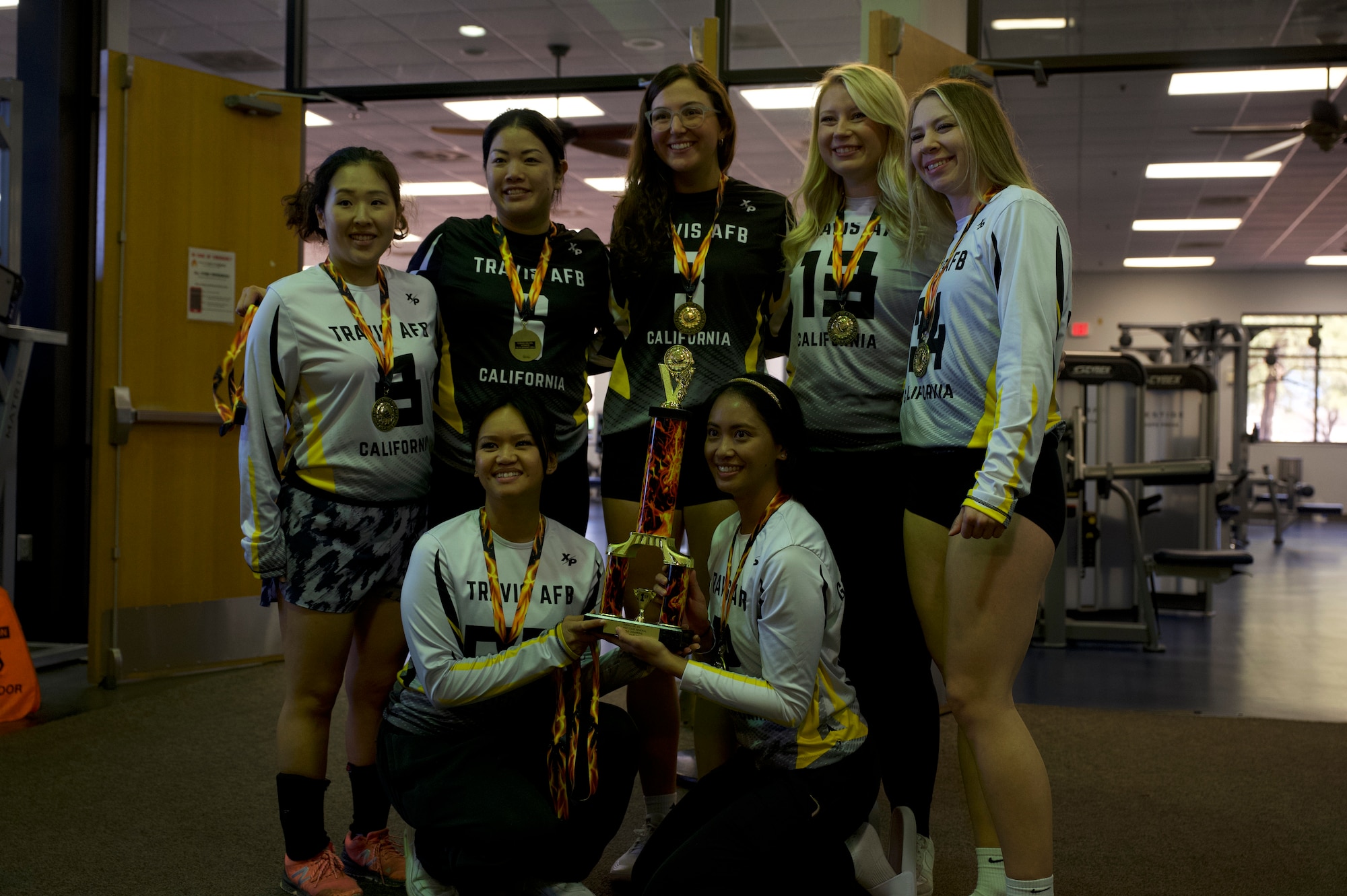 U.S. Airmen on the women’s division of the Travis Air Force Base volleyball team receive an award at Davis-Monthan Air Force Base, Ariz., Jan. 14, 2024. The women’s division of Travis Air Force Base’s volleyball team secured a spot in the national tournament on Fort Sam Houston, Texas. (U.S. Air Force photo by Airman 1st Class Robert Allen Cooke III)