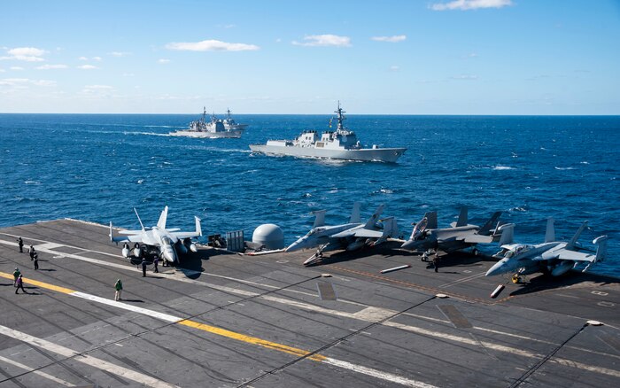 The Nimitz-class aircraft carrier USS Carl Vinson (CVN 70), the Sejong the Great-class guided-missile destroyer ROKS Sejong the Great (DDG-991) from the Republic of Korea Navy, the Kongo-class guided-missile destroyer JS Kongo (DDG-173) from the Japan Maritime Self-Defense Force, sail together during a trilateral exercise, Jan. 16. The exercise allowed maritime forces from Japan, Republic of Korea, and U.S. to train together to enhance coordination on maritime domain awareness and other shared security interests. Vinson, flagship of Carrier Strike Group ONE, is deployed to the U.S. 7th Fleet area of operations in support of a free and open Indo-Pacific. (U.S. Navy photo by Mass Communication Specialist 2nd Class Isaiah B. Goessl)