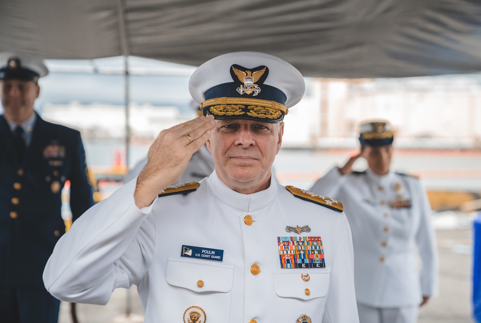 Admiral Steven Poulin, U.S. Coast Guard Vice Commandant, renders a hand salute before the Harriet Lane (WMEC 903) change of home port ceremony at Joint Base Pearl Harbor Hickam, Jan. 16, 2024. Harriet Lane recently transferred to Hawaii from its former home port in Portsmouth Virginia. (U.S. Coast Guard photo by Petty Officer 2nd Class Ty Robertson)