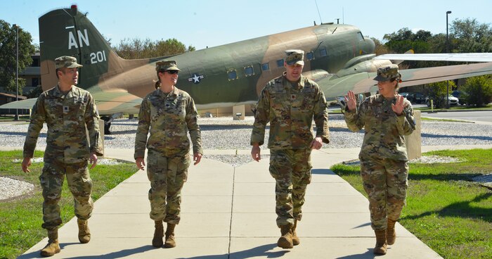 A photo of service members walking towards a building.