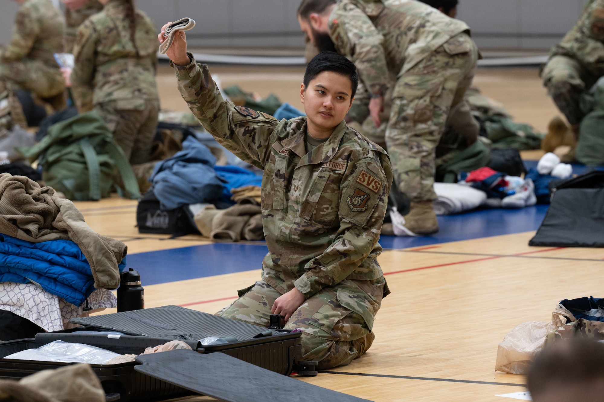U.S. Air Force Tech. Sgt. Scarlet Jimenez, 354th Force Support Squadron food section chief, completes an equipment check during Raven Beddown 2024 on Eielson Air Force Base, Alaska, Jan. 6, 2024.