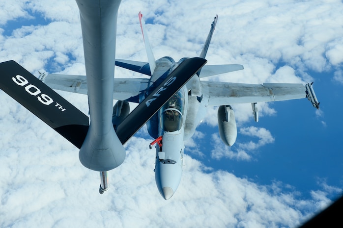 A U.S. Marine Corps F/A-18 Hornet prepares to be refueled by a U.S. Air Force KC-135 Stratotanker from Kadena Air Base over the Pacific, Jan. 3, 2024. The Hornet remains the workhorse of Marine Corps tactical aviation, and supports operational deployments around the globe. (U.S. Air Force photo by Senior Airman Cedriue Oldaker)