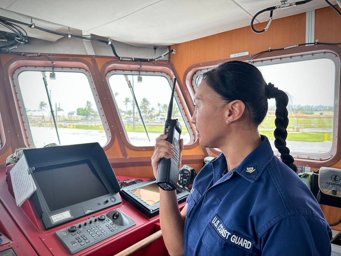 Petty Officer 3rd Class Triana Perez, an information systems technician, conducts a successful radio check over VHF-FM communications from the bridge of the USCGC Myrtle Hazard (WPC 1139) following an outage in Guam on Jan. 17, 2024. The U.S. Coast Guard Forces Micronesia/Sector Guam crews successfully resolved the Rescue 21 issue restoring VHF-FM radio communications in the Mariana Islands, the evening of Jan. 16. (U.S. Coast Guard photo by Chief Warrant Officer Sara Muir)