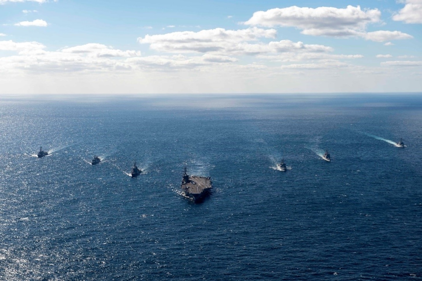 The Nimitz-class aircraft carrier USS Carl Vinson (CVN 70), the Sejong the Great-class guided-missile destroyer ROKS Sejong the Great (DDG-991) from the Republic of Korea Navy, the Kongo-class guided-missile destroyer JS Kongo (DDG-173) from the Japan Maritime Self-Defense Force, sail together during a trilateral exercise, Jan. 16. The exercise allowed maritime forces from Japan, Republic of Korea, and U.S. to train together to enhance coordination on maritime domain awareness and other shared security interests. Vinson, flagship of Carrier Strike Group ONE, is deployed to the U.S. 7th Fleet area of operations in support of a free and open Indo-Pacific. (U.S. Navy photo by Mass Communication Specialist 2nd Class Isaiah B. Goessl)