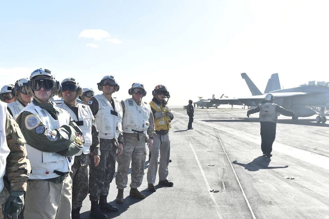 The Republic of Korea (ROK) and United States navies and Japan Maritime Self-Defense Force (JMSDF) conduct a trilateral-naval exercise, Jan. 15 to Jan. 17, 2024, international waters near the Korean Peninsula and Japan. Gen. Paul LaCamera, commander, United Nations Command, Combined Forces Command, and United States Forces Korea, and Adm. Kim Myung-soo, ROK Joint Chiefs of Staff chairman visit the USS Carl Vinson, Monday, Jan. 15, during the trilateral naval exercise