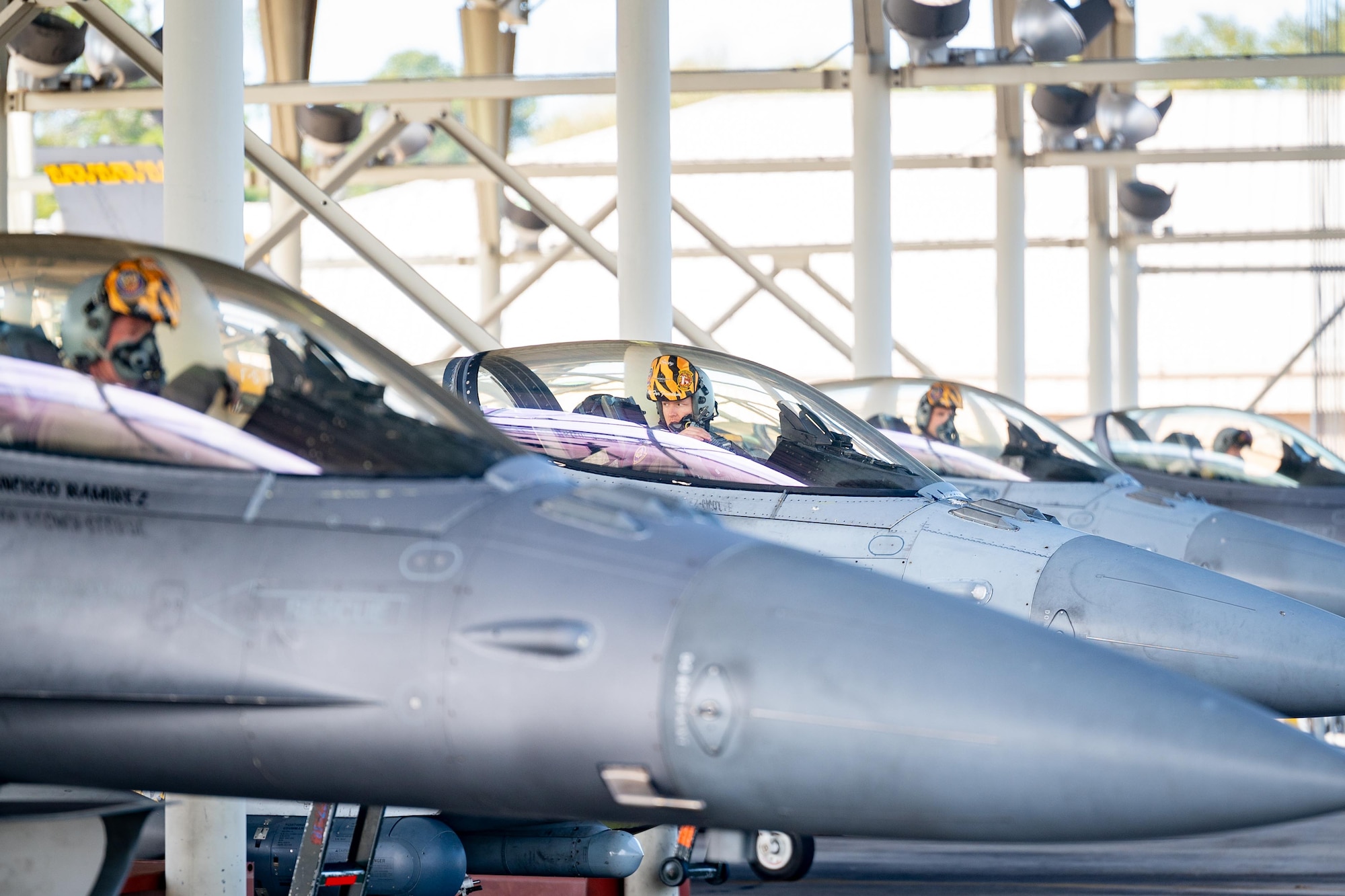 Pilots perform pre-flight checks from within their aircraft.