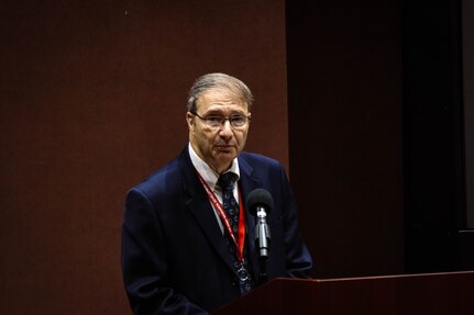 Man at podium.